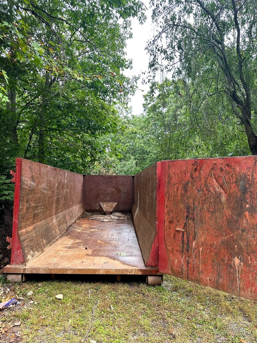 Bluegrass Hauling & Roll-Off heavy construction dumpster on job site in Louisville