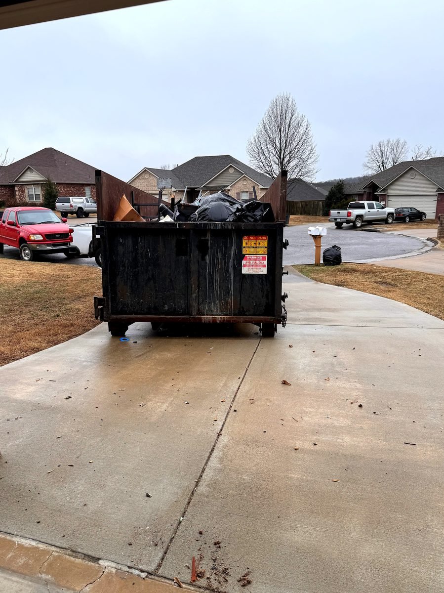 Bluegrass Hauling & Roll-Off roll-off delivery truck and driver operating in Louisville