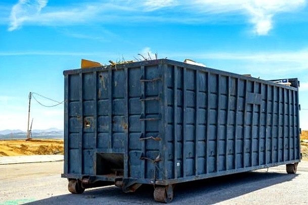 Riverbend Haul & Container roll-off delivery truck and driver operating in Sacramento